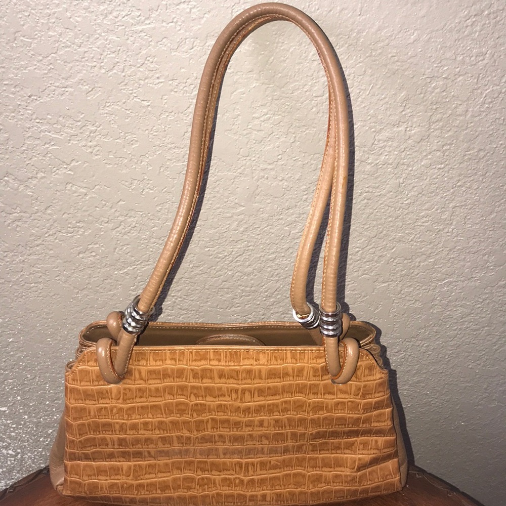Light brown handbag.